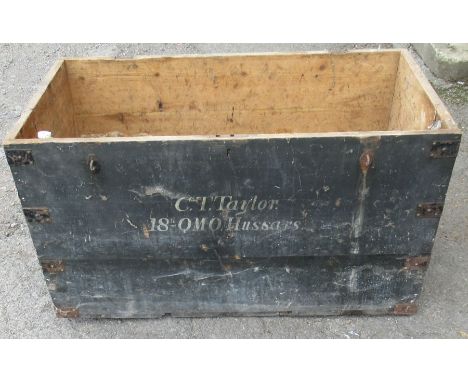A pine trunk, with metal bands and handles, inscribed C.T. Taylor 18th QMO Hussars, 48ins x 25ins, height 26ins