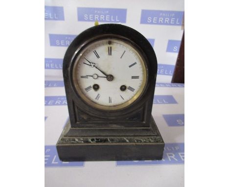 A black slate mantle clock