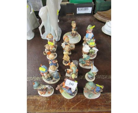 A collection of Hummel/Goebel figures