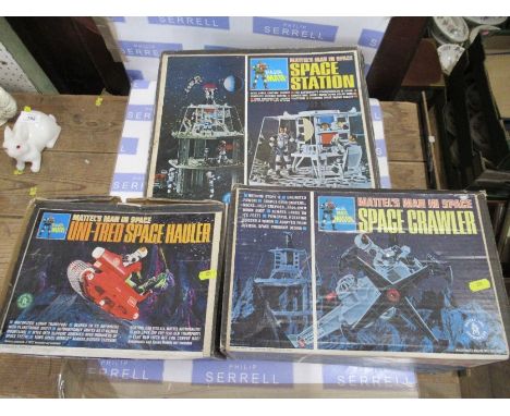 A Mattel 'Man in Space' boxed Space Station, together with a boxed Space Crawler and a boxed Uni Tred Space Hauler, from the 