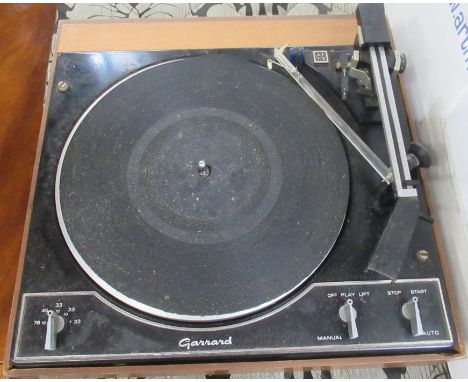 A Gerrard record player together with a pare of black boots and projector with case