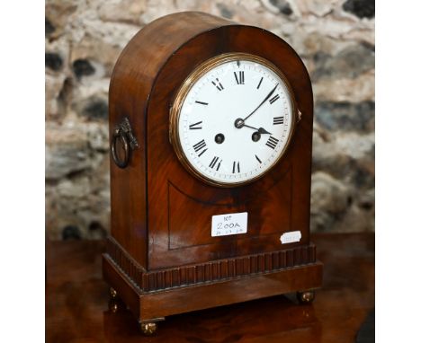 An early 20th century French mahogany arched mantel clock with brass ring handles and ball feet, eight day Samuel Marti medai