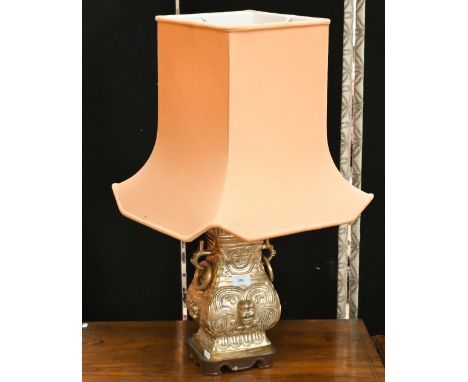 A Chinese brass table lamp of archaic form, with shade 70 cm high overall 