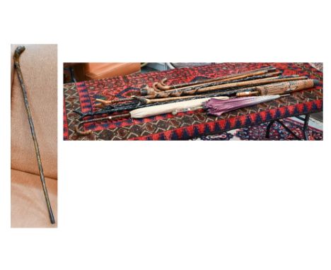 An antique Welsh walking stick, the handle as a dogs head and radially carved in relief 'Whose Matthew Hill Esqr. 44 Carlisle