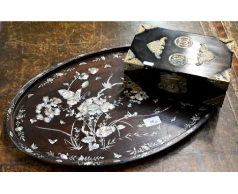 A Chinese oval rosewood tray richly inlaid with mother of pearl flowers, birds and insects, 54 x 34.5 cm, to/w a brass mounte