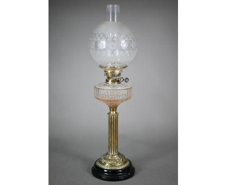 An antique brass column and etched glass shade oil lamp, raised on a brown glazed pottery base, 67 cm h o/all 