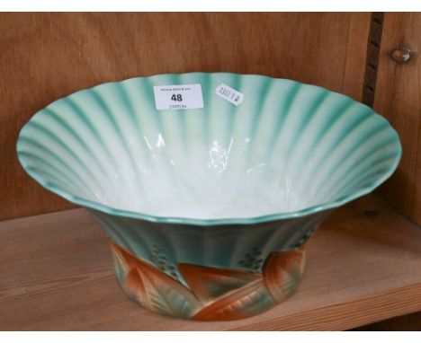 A Royal Worcester Art Deco bowl with flared and fluted rim and moulded gilt foliate foot, date mark for 1933, no. 3043, 25 cm
