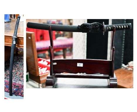 A modern Japanese Katana sword with gilt metal Tsuba, the cord-bound fishskin handle with menuki, 74.5 cm blade, in lacquer s