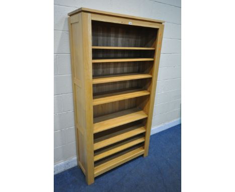 A JB GLOBAL LIGHT OAK OPEN BOOKCASE, with five adjustable and two fixed shelves, width 100cm x depth 39cm x height 190cm (con