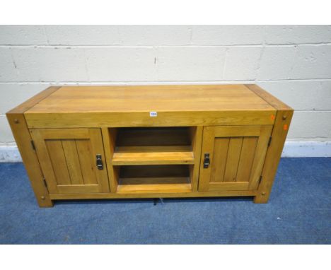 A JB GLOBAL LIGHT OAK CABINET, with two doors flanking a central shelf, width 136cm x depth 46cm x height 60cm (condition rep