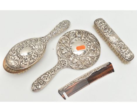 A FOUR PIECE SILVER VANITY TABLE SET, comprising of a hair brush, clothes brush, hand held mirror and comb, embossed foliate 