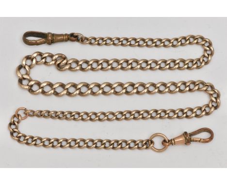 A YELLOW METAL CURB LINK ALBERT CHAIN, a graduated chain, fitted with two rolled gold lobster clasps, approximate length incl