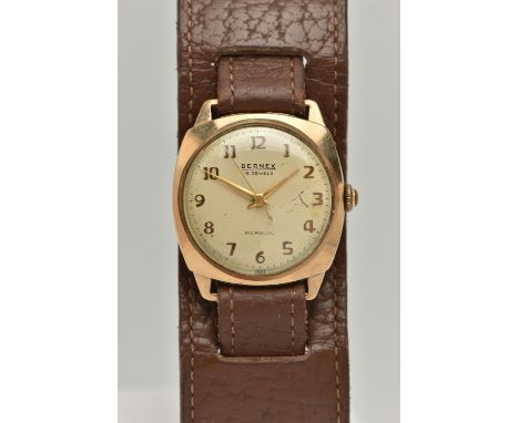 A 9CT GOLD BERNEX WATCH, the gold coloured face with Arabic numerals, signed Bernex 18 Jewels Incabloc, to a wide brown leath