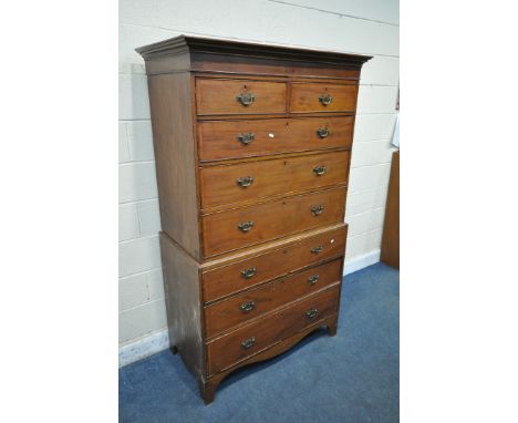 A GEORGIAN MAHOGANY CHEST ON CHEST, fitted with an arrangement of eight drawers, a loose cornice, brass swan neck handles, on