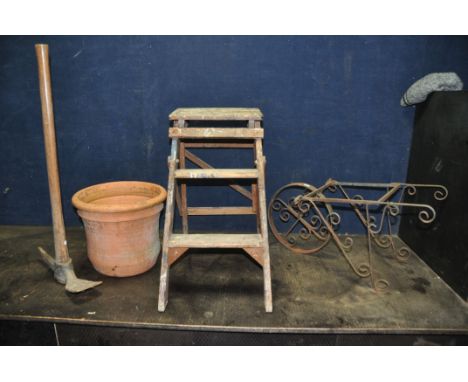 A SET OF VINTAGE WOODEN STEP STOOL 58cm high a terracotta plant pot, a wrought iron garden wheel barrow ornament, a New Home 