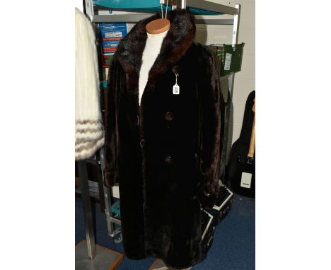 A VINTAGE LADIES DARK BROWN  COAT, with a brown fur collar, covered buttons, embroidered satin lining, made and styled in Ont