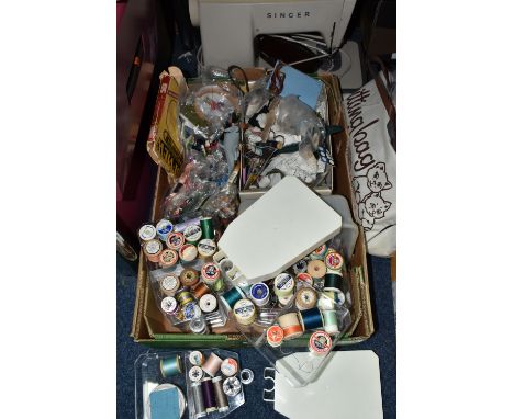 A BOX AND LOOSE SEWING MACHINE AND HABERDASHERY ITEMS, to include a cased Singer electric sewing machine, threads, buttons, e