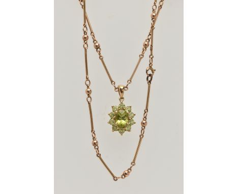 A 9CT GOLD GEM CLUSTER PENDANT WITH CHAIN, the pendant designed as a central oval green gem, surrounded by circular cut perid