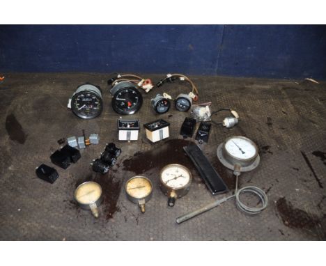 A TRAY CONTAINING VINTAGE CAR PARTS AND DIALS including rev counter, oedometer, volt and fuel gauges, Lucas, Hella, Bosch rel