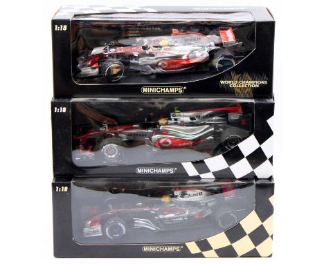 A Minichamps Maclaren Mercedes boxed diecast group to include a World Champions Collection Lewis Hamilton Vodafone Maclaren M
