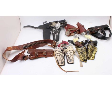 A collection of vintage and modern release leather and plastic child's gun holsters and contents, various to include a Wester