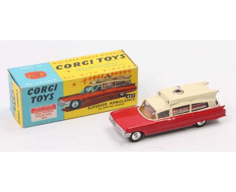 A Corgi Toys No. 437 Superior Ambulance on Cadillac chassis comprising of red and cream body with brown interior and spun hub
