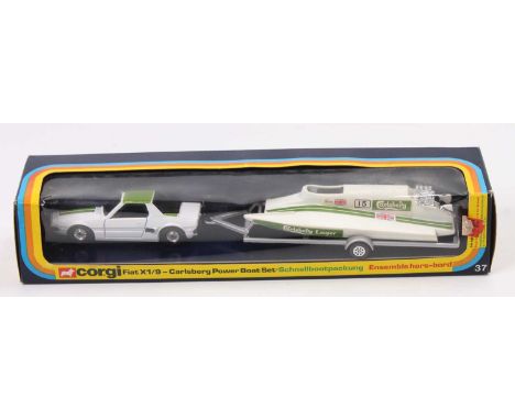 A Corgi Toys gift set 37 Fiat X19 Carlsberg power boat gift set housed in the original window display packaging