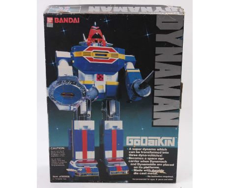 A Bandai Made in Japan 1984 diecast and plastic model of Dynaman action robot housed in the original lift-off lid window disp