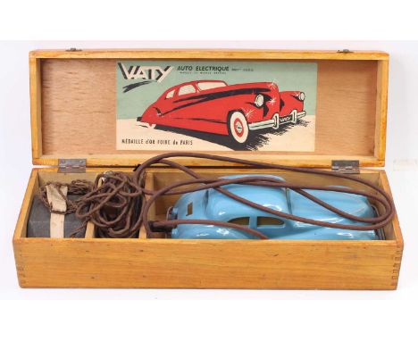 A Vaty Auto electric wooden cased model of a blue Vaty electrically powered saloon comprising of blue body with silver lining