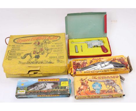 A collection of Wild West cap guns and outfits to include a BCM Company Authentic Replica model of an Apache repeating cap pi