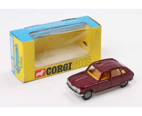 A Corgi Toys No. 260 Renault 16 comprising of maroon body with yellow interior and cast hubs housed in the original window di