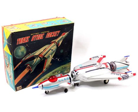 Nomura for Rosko Tested tinplate and battery operated model of a Three Stage Rocket, comprising sliver, red and blue body, ex