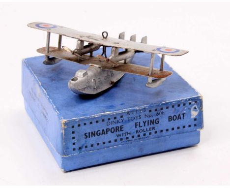 Dinky Toys No. 60H Singapore Flying Boat comprising of a silver body with RAF roundels and four 2-blade silver propellers, so