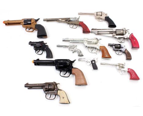 12 various cast iron diecast and plastic model cap guns and pistols by mixed manufacturers to include Hubley, Crescent, Lones