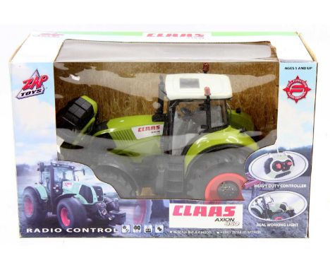 A Zap Toys radio controlled model of a Class Axion 850 radio controlled tractor housed in the original window packaging