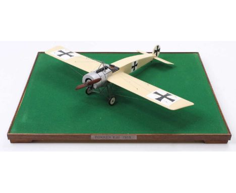 An exhibition quality wooden and balsa wood model of a Fokker E3 1915  aircraft, finished in cream with silver engine cowling