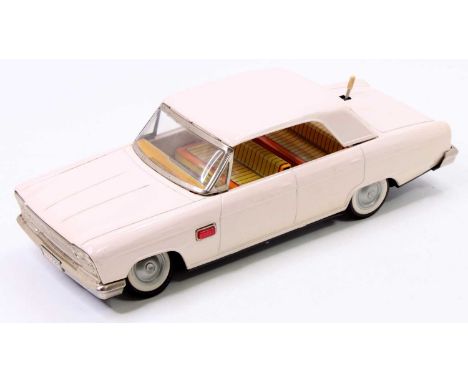 Nomura - TN Toys of Japan large scale tinplate battery operated Datsun comprising a white body with orange &amp; yellow strip