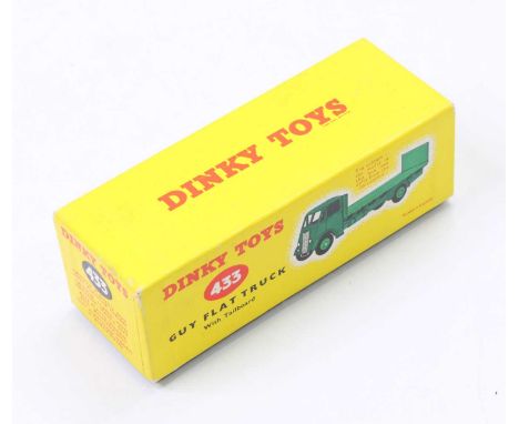 A Dinky Toys No. 433 Guy Flat Truck with Tailboard original empty box, a later issue yellow card box showing a green model wi