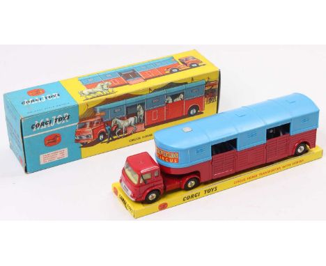 A Corgi Toys No. 1130 circus horse transporter with horses comprising of red and blue body with spun hubs housed in the origi
