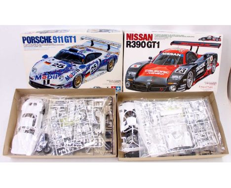2 Tamiya 1/24th scale Sports Car Series models comprising No. 24186 Porsche 911 GT1, and No. 24192 Nissan R390 GT1 - both mod