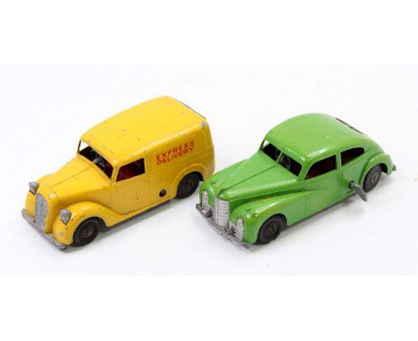 Mettoy large scale diecast and clockwork group of 2 comprising an Express Delivery Van in yellow with black rubber tyres and 