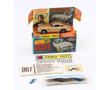 Corgi Toys No. 261 James Bond Aston Martin DB5 comprising gold body with red interior and wire work hubs, mechanisms in fully