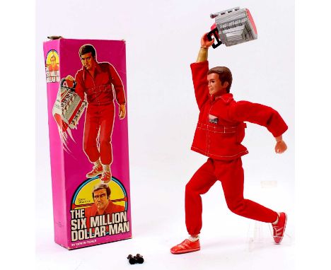 A Denys Fisher Six Million Dollar Man Colonel Steve Austin action figure with original clothing, shoes and plastic engine com