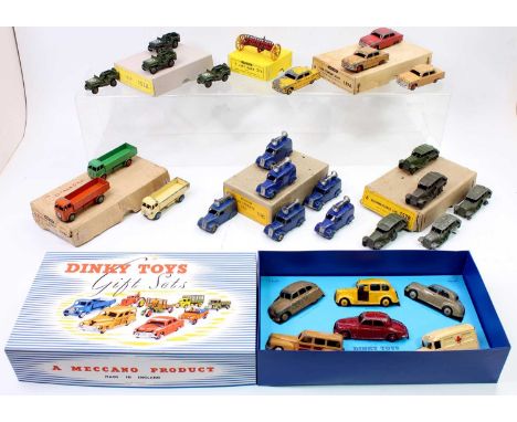 A collection of Dinky Toys original and reproduction trade boxes, some with contents to include No. 34C Loud Speaker Van, No.