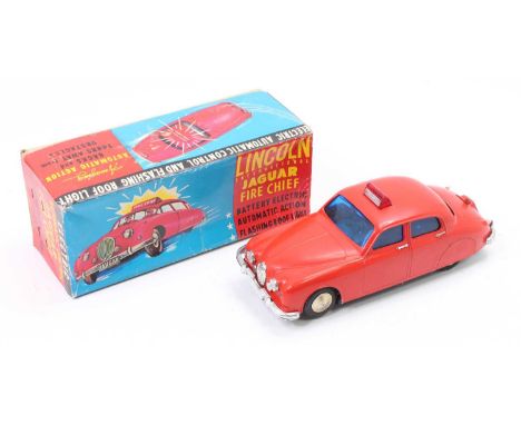 A Lincoln International plastic and battery operated model of a Jaguar fire engine comprising red body with blue glazing and 
