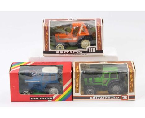 A Britains boxed tractor group, all housed in original window packaging to include a No. 9528 Fiat tractor finished in orange