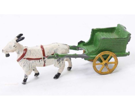 A rare Charbens early 20th century goat and cart comprising of white goat with brown tack, complete with green cart with spok