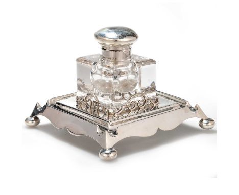 AN EDWARDIAN SILVER AND GLASS INKWELL by Harry Synyer &amp; Charles Joseph Beddoes, Birmingham 1901, the cube inkwell with a 