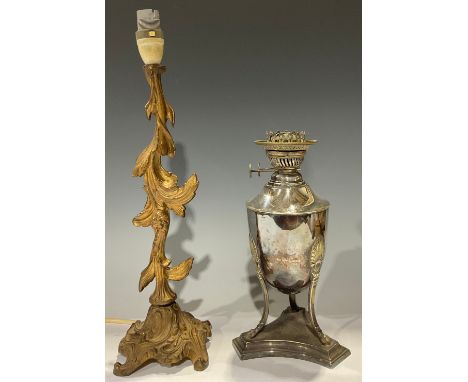 A Victorian silver plated oil lamp, 28cm high; a gilt metal  Rococo style table lamp, 43cm high (2) 