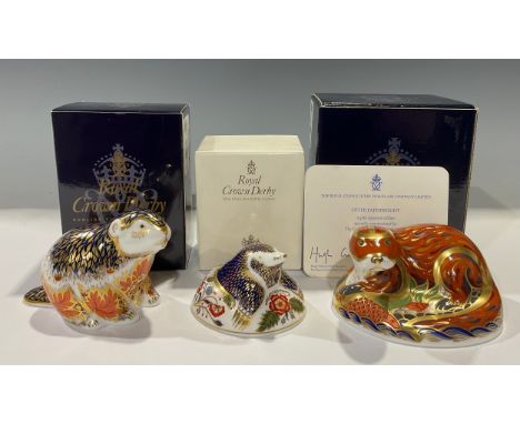 A Royal Crown Derby paperweight, Riverbank Beaver, limited edition 4,862/5,000, 21st anniversary special gold stopper; others